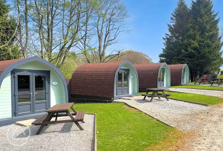 Camping pods with outdoor picnic benches