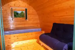 Pod with a double bed and a fold-down futon for two children