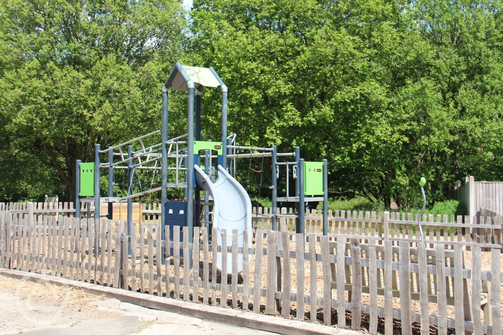 Play area with climbing frames and swings