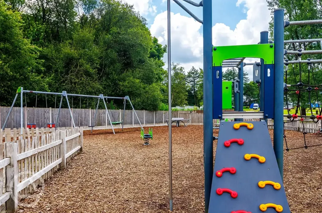 Play area with climbing frames and swings