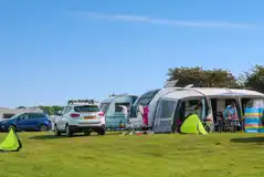 Electric grass pitches measuring approximately 15m by 9m