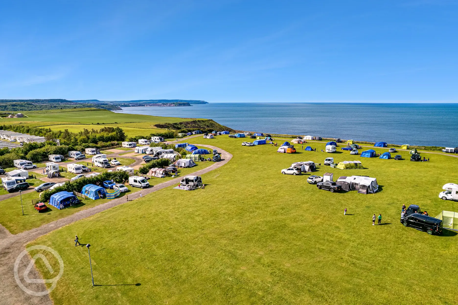 Grass pitches with sea views and all weather touring super pitches