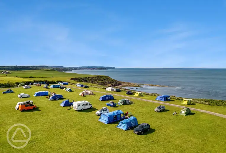 Non electric grass pitches with Scarborough sea views
