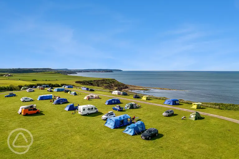 Non electric grass pitches with Scarborough sea views