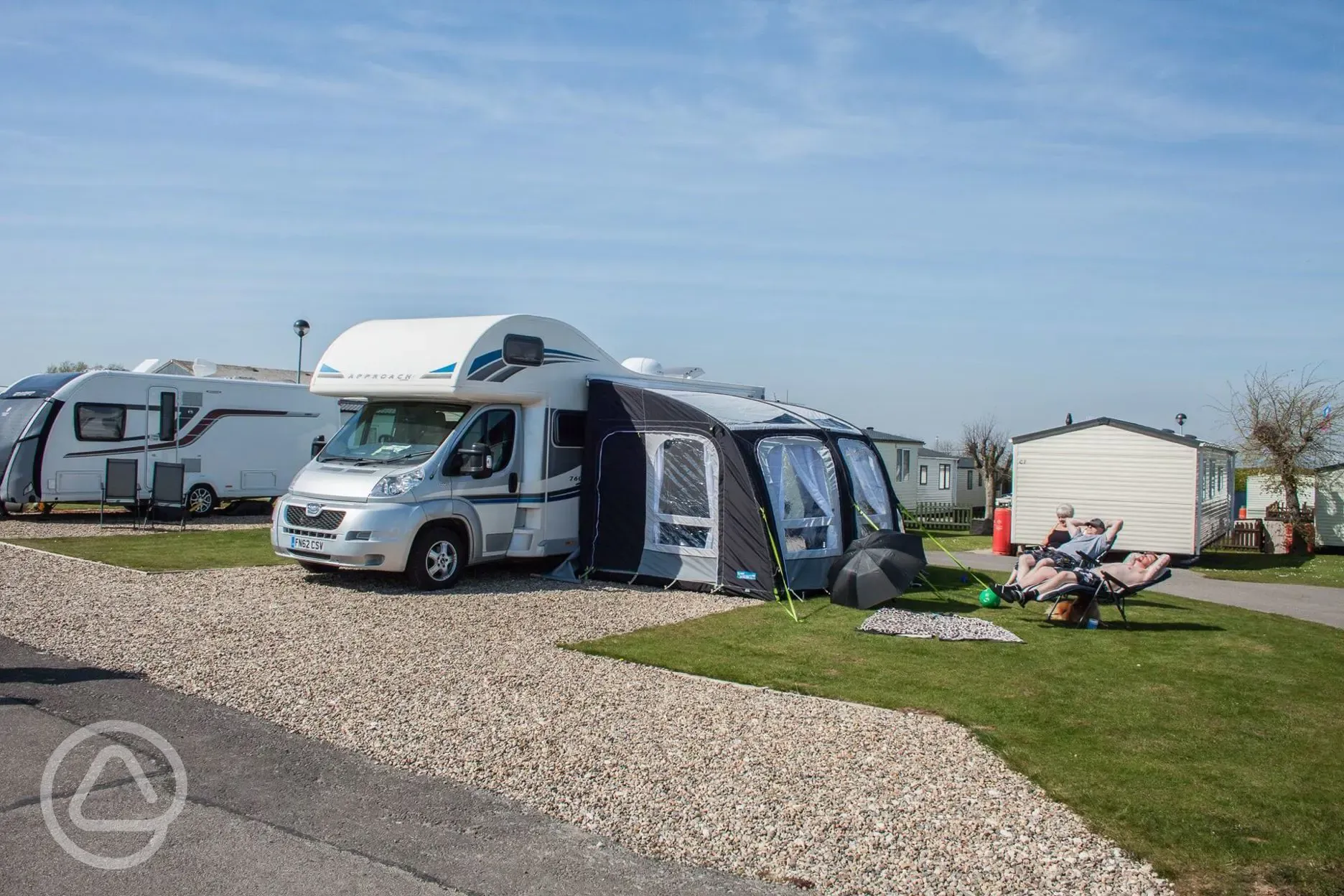 Motorhome with awning on all weather touring super pitch