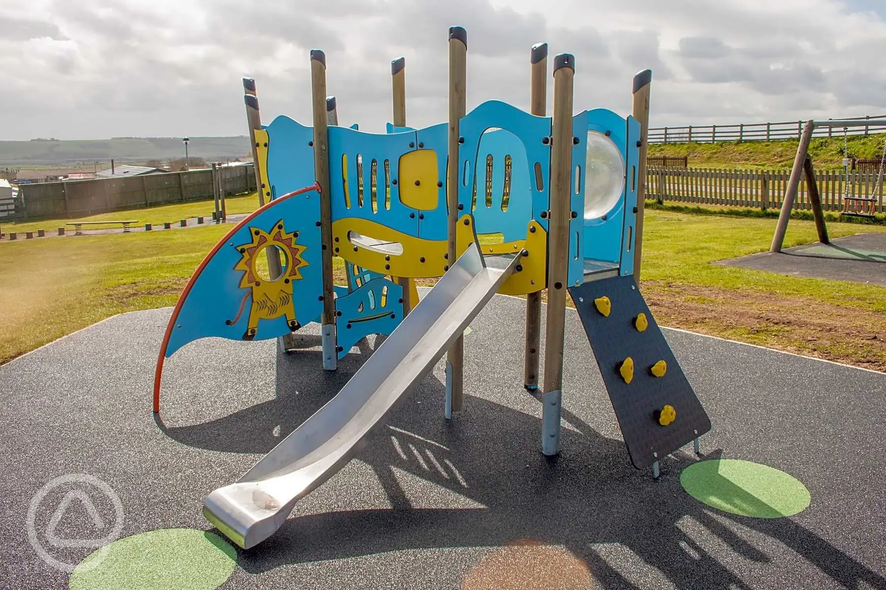 Children's play area with slide and swings