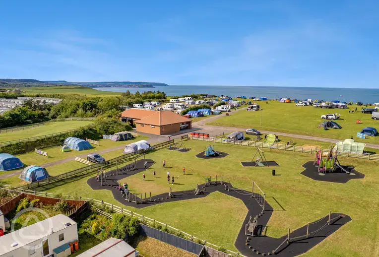 Aerial view of Crows Nest pitches and play area overlooking the Yorkshire coast