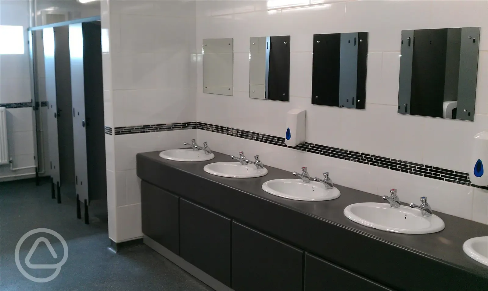 Toilet block with sinks and mirrors