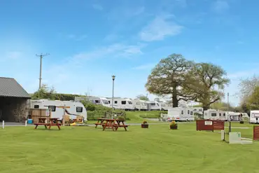 Tourers on the premium electric grass pitches at Sleningford Watermill Park