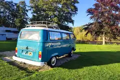 VW campervan on a river view electric hardstanding pitches