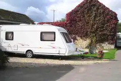 Premium electric courtyard hardstanding pitches set away from the water