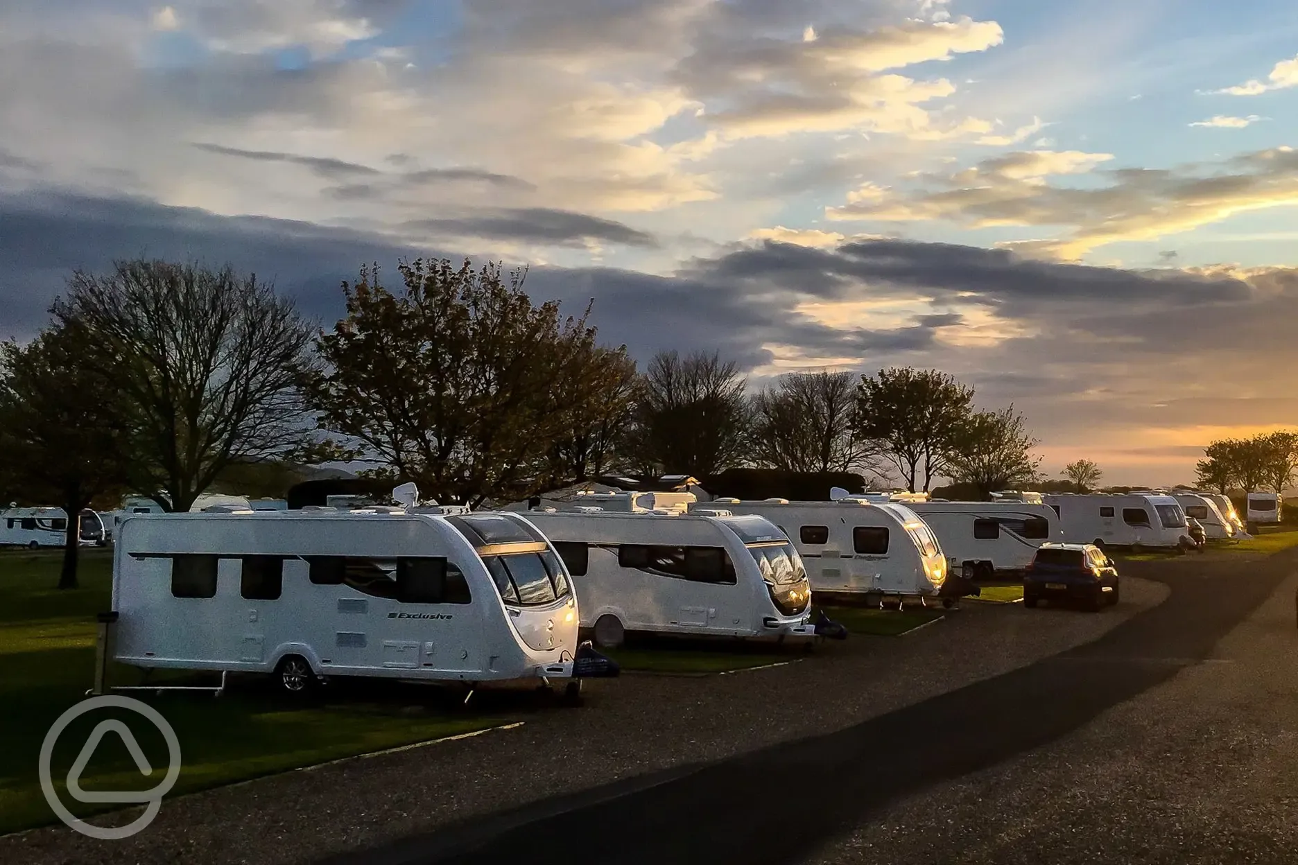Fully serviced hardstanding pitches at sunset