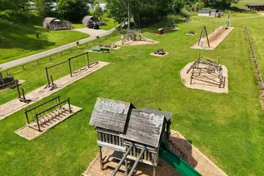 Aerial of the adventure play park with a zip wire and climbing frames