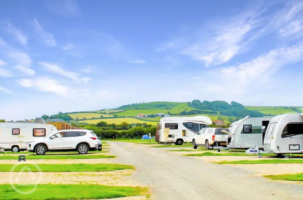 Hardstanding pitches with countryside views and space to park along side