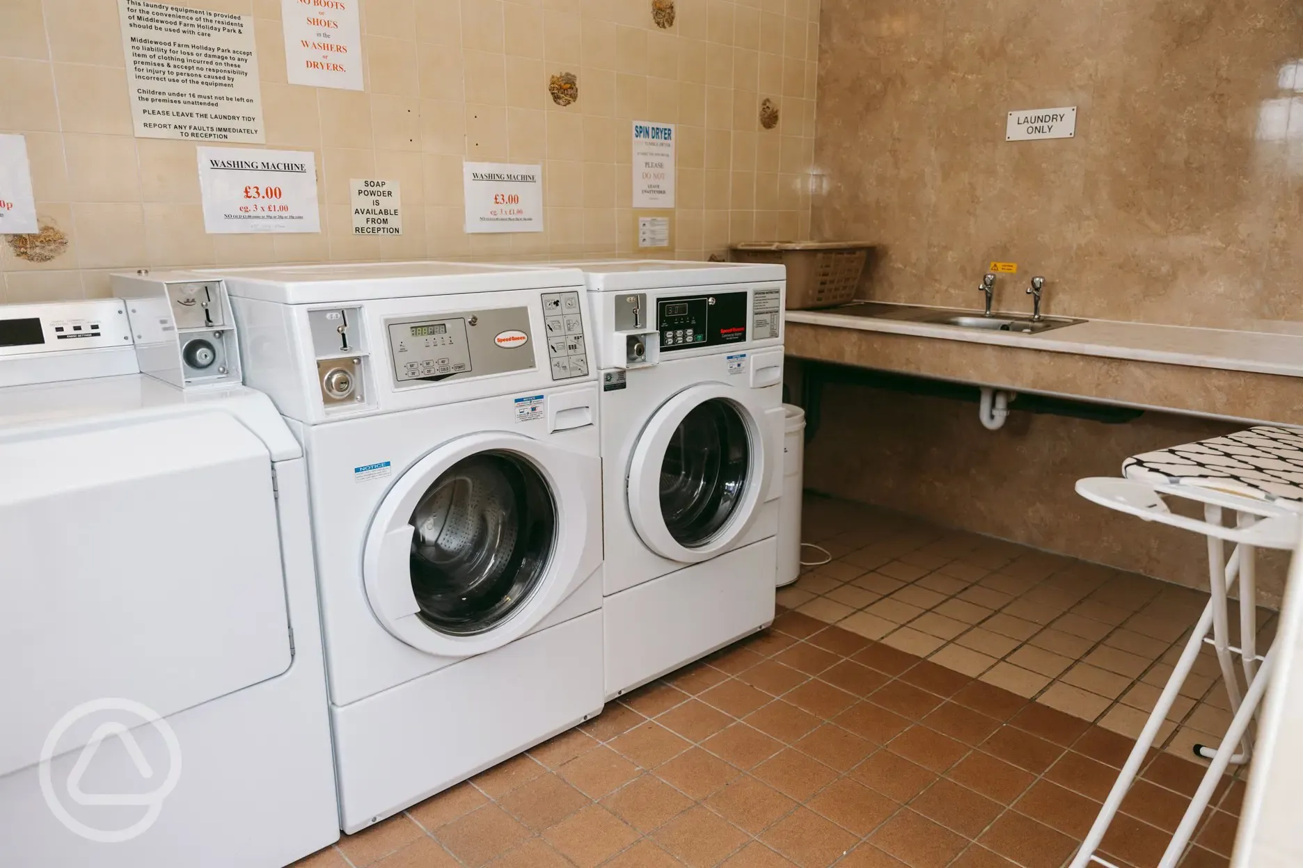Coin operated laundry room with washers and dryers