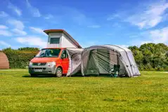 Grass pitches with space for an awning