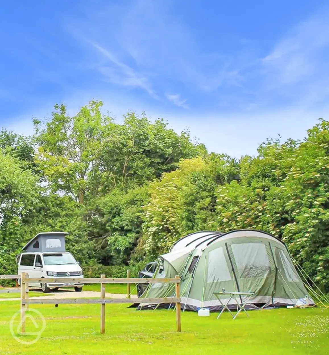 Grass pitches surrounded by trees
