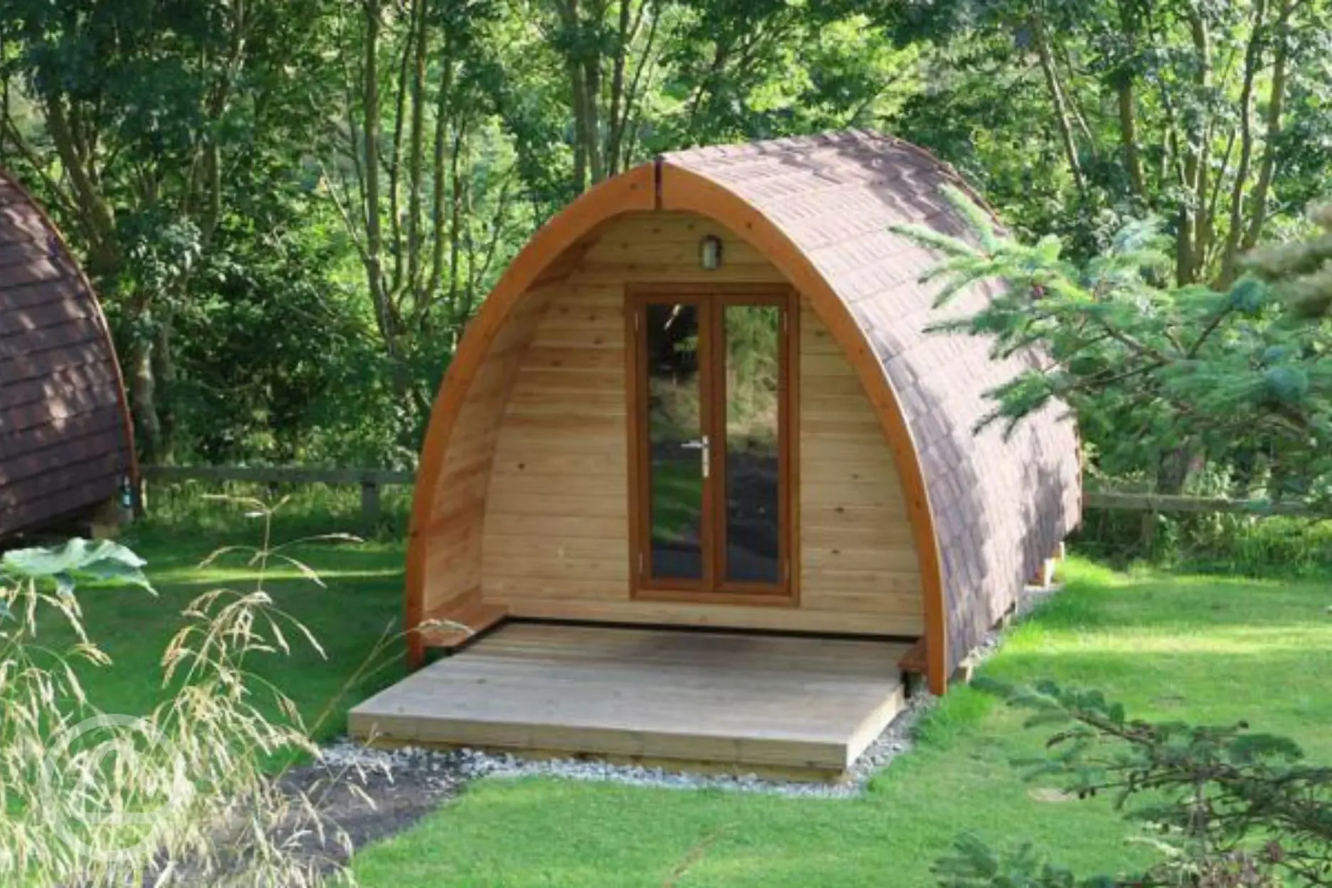 Camping pods surrounded by woodland Camping pods surrounded by woodland