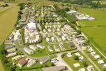 Aerial of Upwood Holiday Park with grass and hardstanding pitches, plus lodges