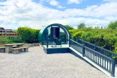 Super glamping pod with ramp access and a glass front