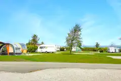 Electric hardstanding pitches (8m x 8m) with 10 amp hook ups