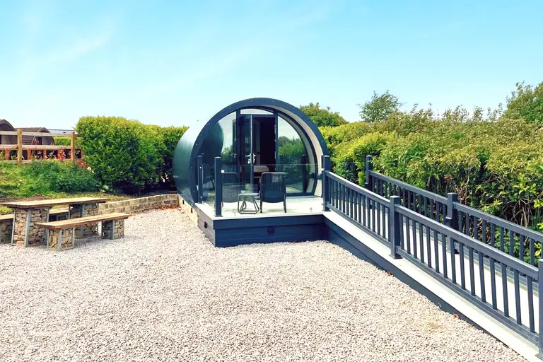 Super glamping pod with ramp access and a glass front