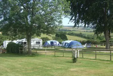 Views across our camping field. Pitches are terraced or gently sloping.