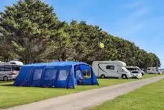 Electric grass pitches with a larger tent and motorhome (medium) Electric grass pitches with a larger tent and motorhome (medium)