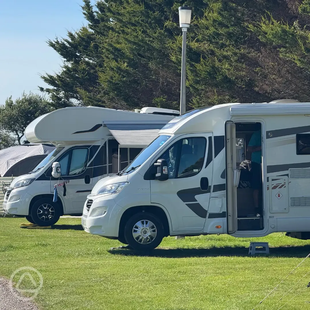 Grass pitches with parked motorhomes