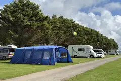 Electric grass pitches with a larger tent and motorhome (medium)