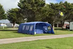 Grass camping pitches with a large tent