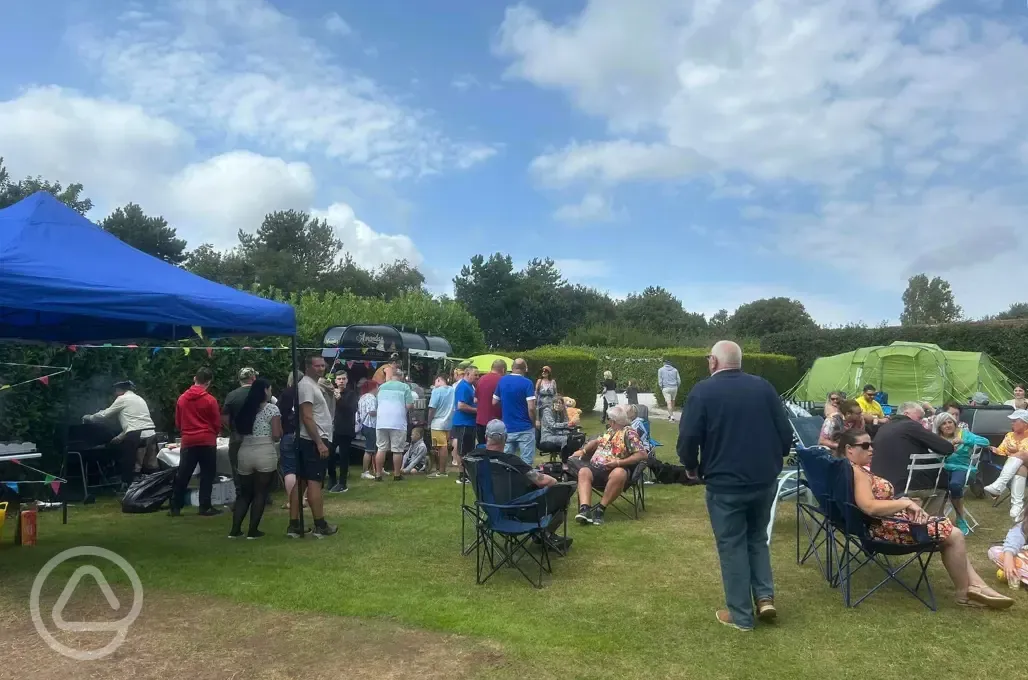 Campers gathering around the visiting food truck