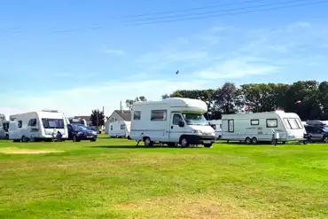 Tourers on optional electric pitches at Pennymoor Caravan and Camping Park