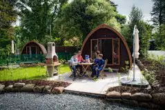 Mega glamping pod with a picnic bench, a parasol, and a BBQ Mega glamping pod with a picnic bench, a parasol, and a BBQ