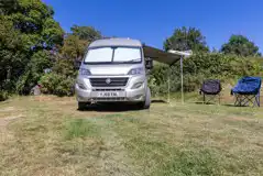 Campervan on an optional electric grass pitch with space for a gazebo/pup tent