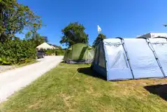 Tents on grass pitches measuring 6m x 6m 