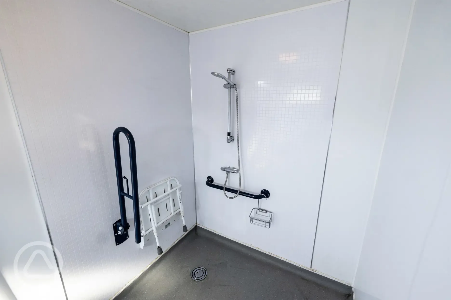 Disabled access bathroom with shower with handrail