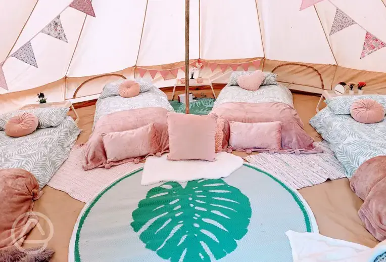 Bell tent interior with single beds