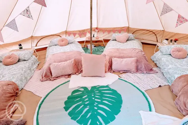 Bell tent interior with single beds