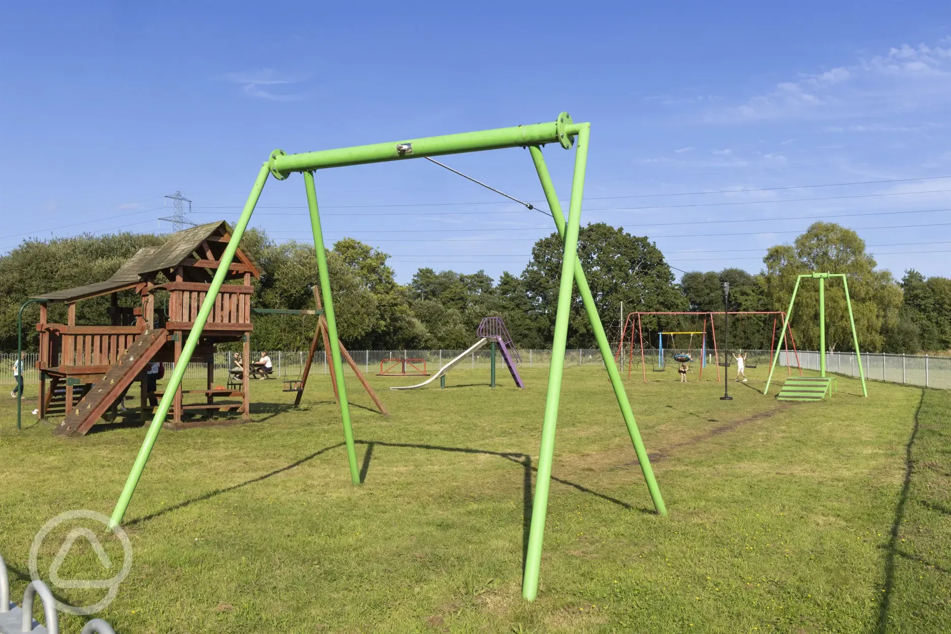 Children's play area with swings and climbing frame