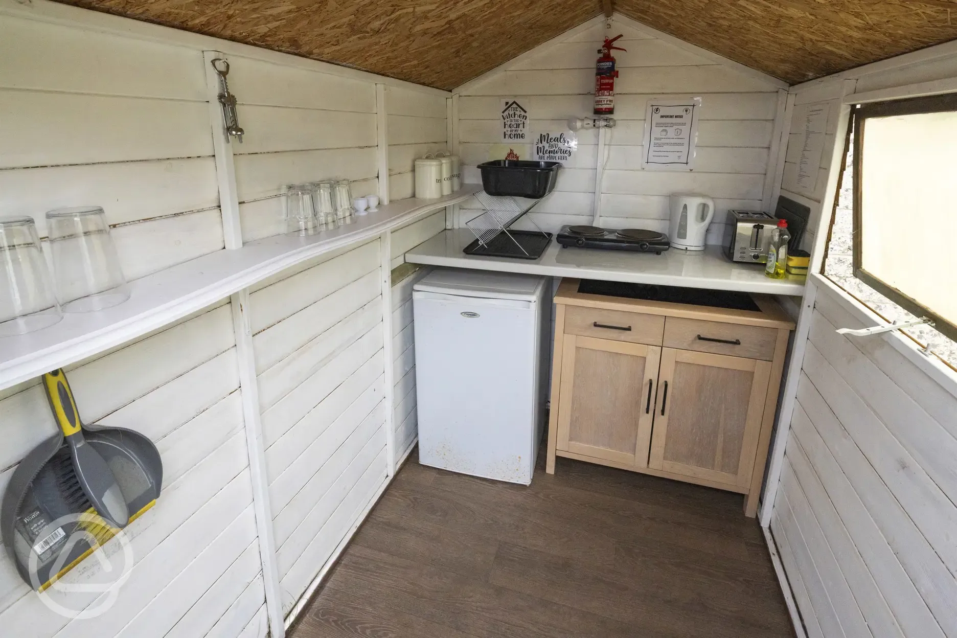 Green shepherd's hut kitchen area