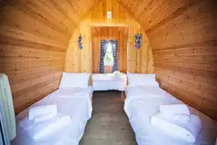 Camping pods with a double and two single beds (bring own bedding)