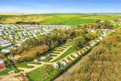 Aerial facing inland towards the Abbeyfield hardstanding touring pitches