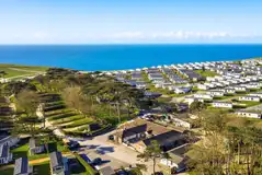 Aerial of the shop, restaurant and Abbeyfield pitches towards the coast