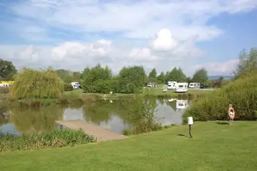 Grass pitches by the lake