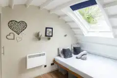 Glamping cabin interior with king size bed, please bring your own bedding