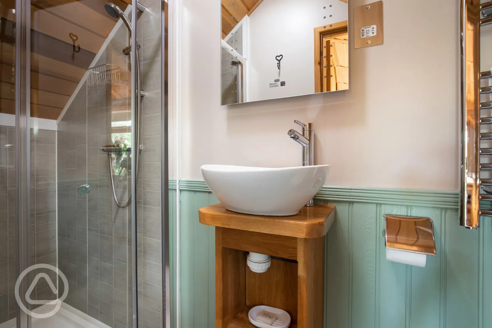 Cedar lodge ensuite with shower, sink, mirror and toilet