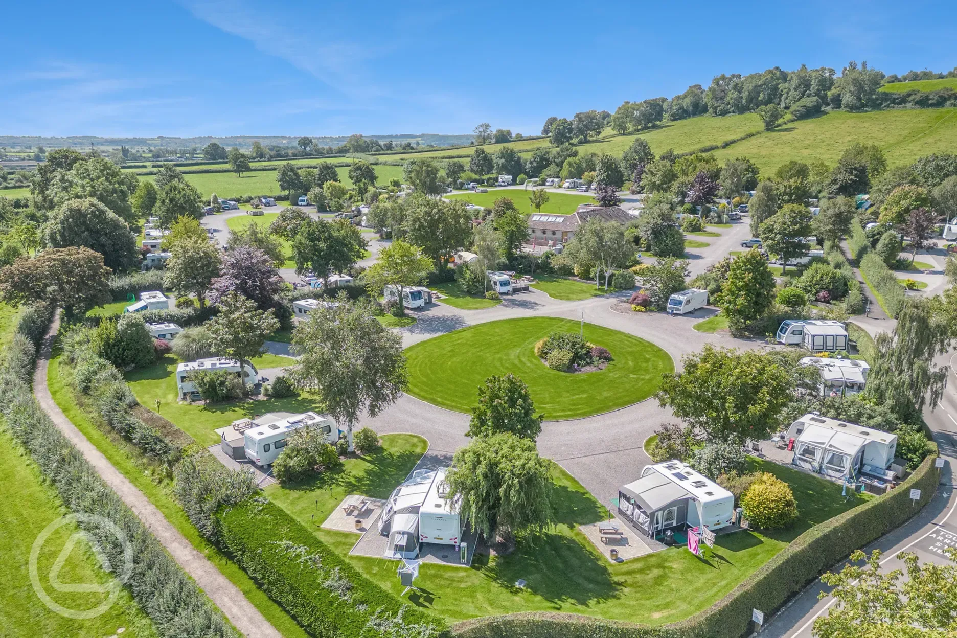 Aerial of Old Oaks Touring Park with views towards Glastonbury Tor Aerial of Old Oaks Touring Park with views towards Glastonbury Tor