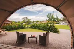 Glamping cabin view of outside seating area