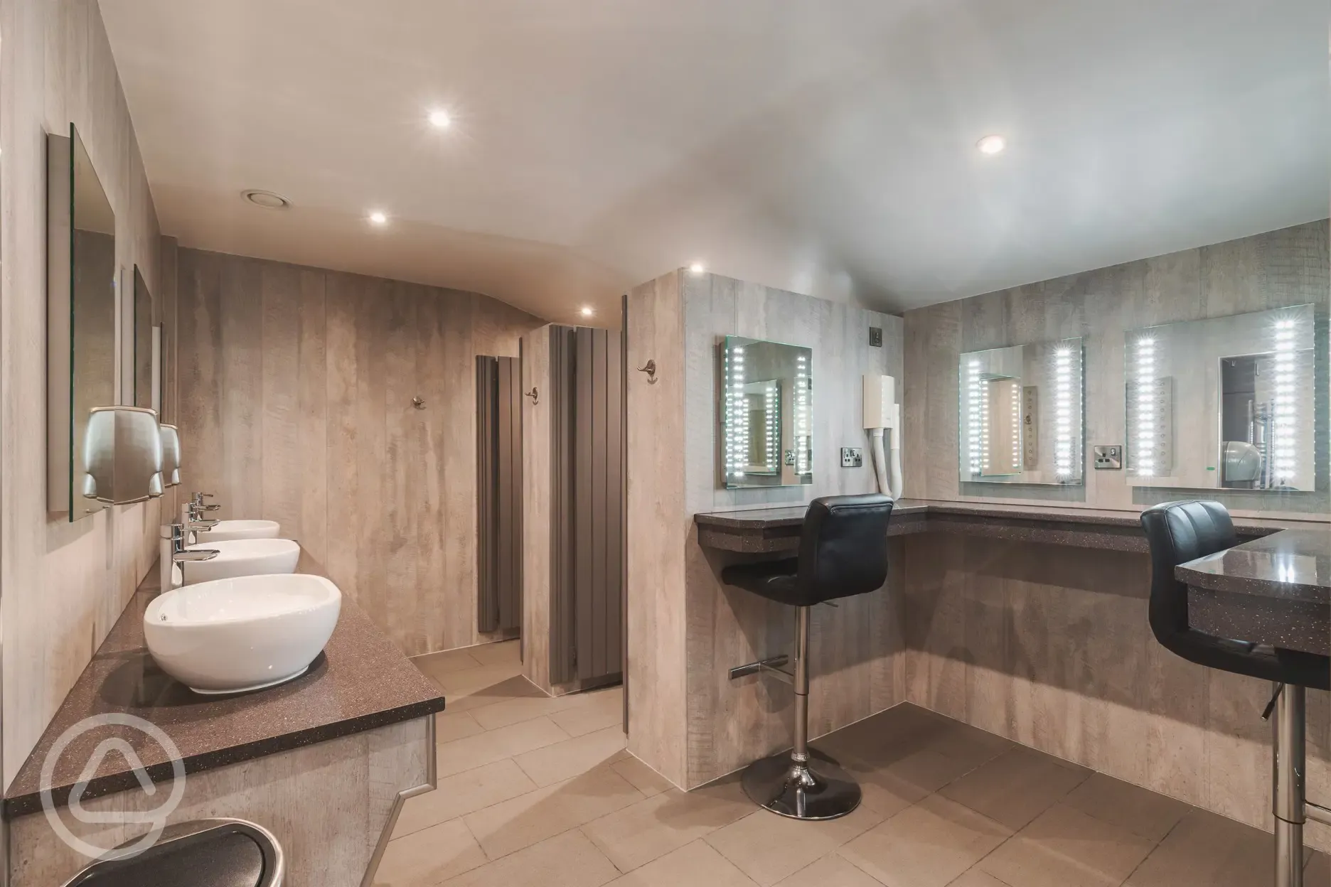 Ladies facilities with sinks, mirrors and vanity area